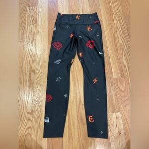 Nike Black and Red Leggings with Bold Design